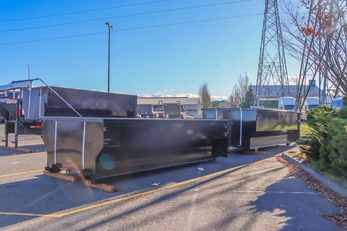 Roll-off dumpster ready for waste disposal at job site for 12 Yard Dumpster Rental in Daphne